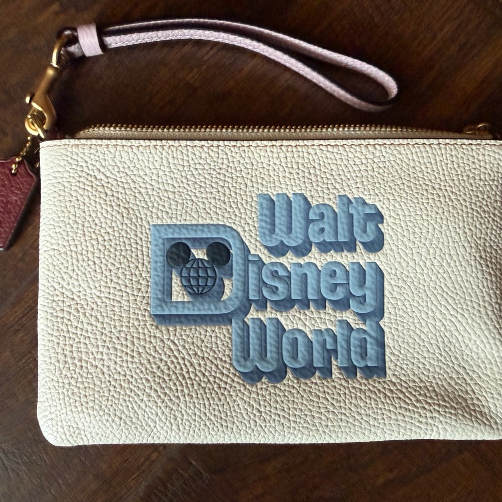 NWOT Coach Disney Parks- White Wristlet with Blue Walt Disney World Logo